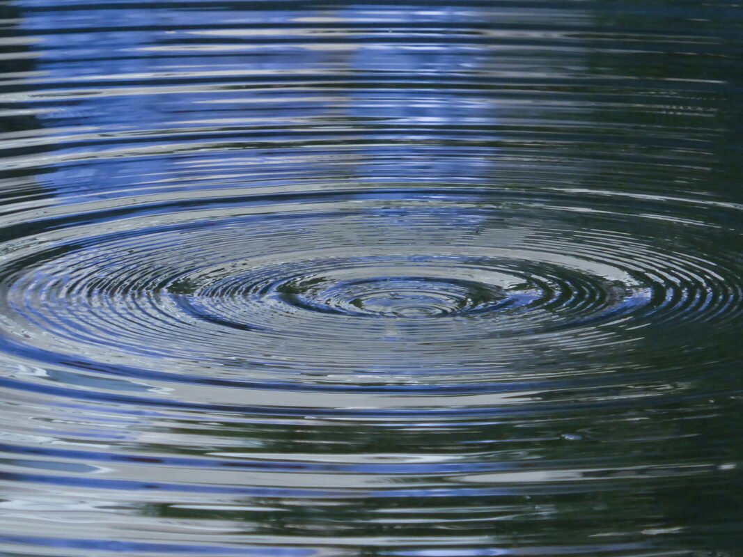 Ripples expanding across water, symbolizing the lasting impact and legacy of the wrinkles we leave behind in others’ lives